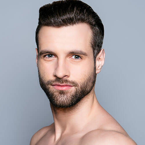 Male model with beard and hair slicked back