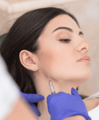 Beautiful woman relaxing during jaw filler treatment