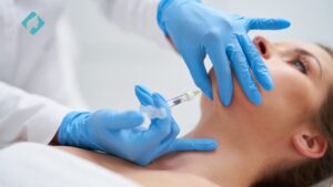 close-up of carboxytherapy procedure on patient’s chin area.