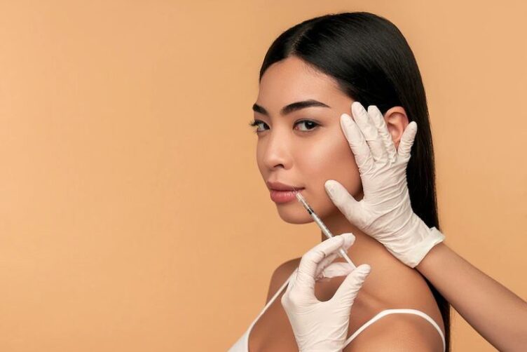A woman with long, straight black hair is receiving after a skin renewal treatment