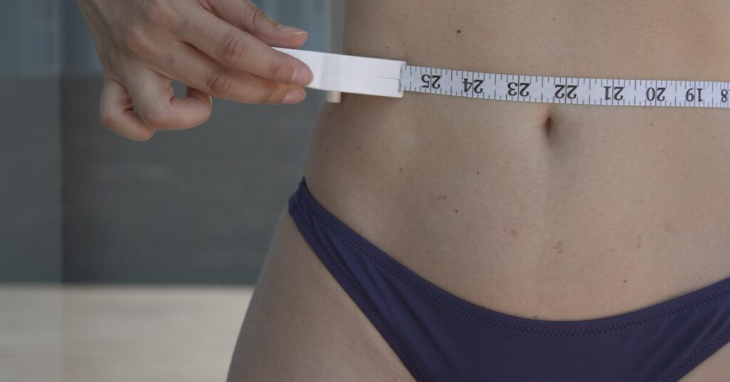 The Ultimate Sculpting Solution For Stubborn Fat Pockets image of a woman who has reduced waist fat